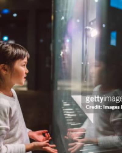 girl viewing museum pieces